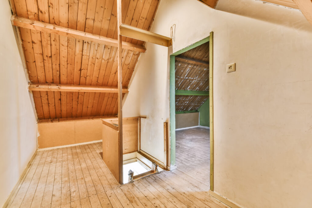 smaller sized loft room with staircase